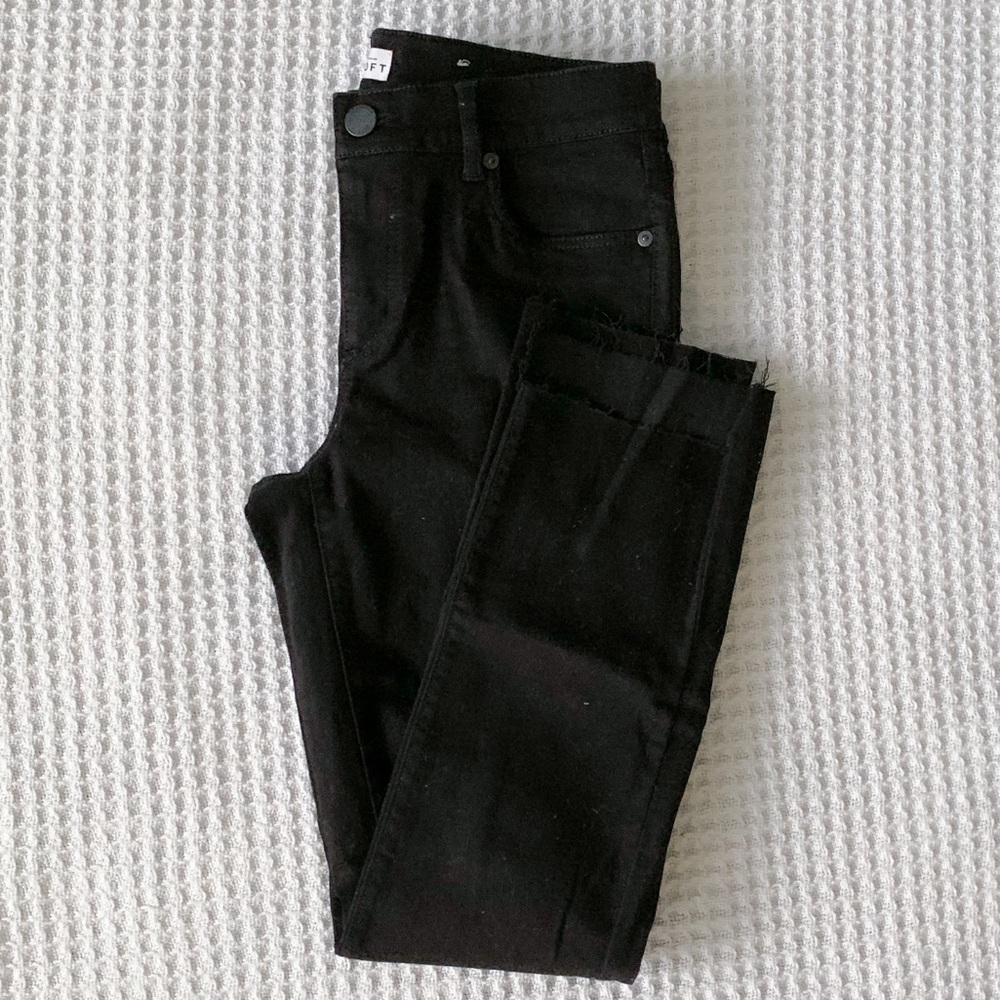 Black skinny step hem jeans
